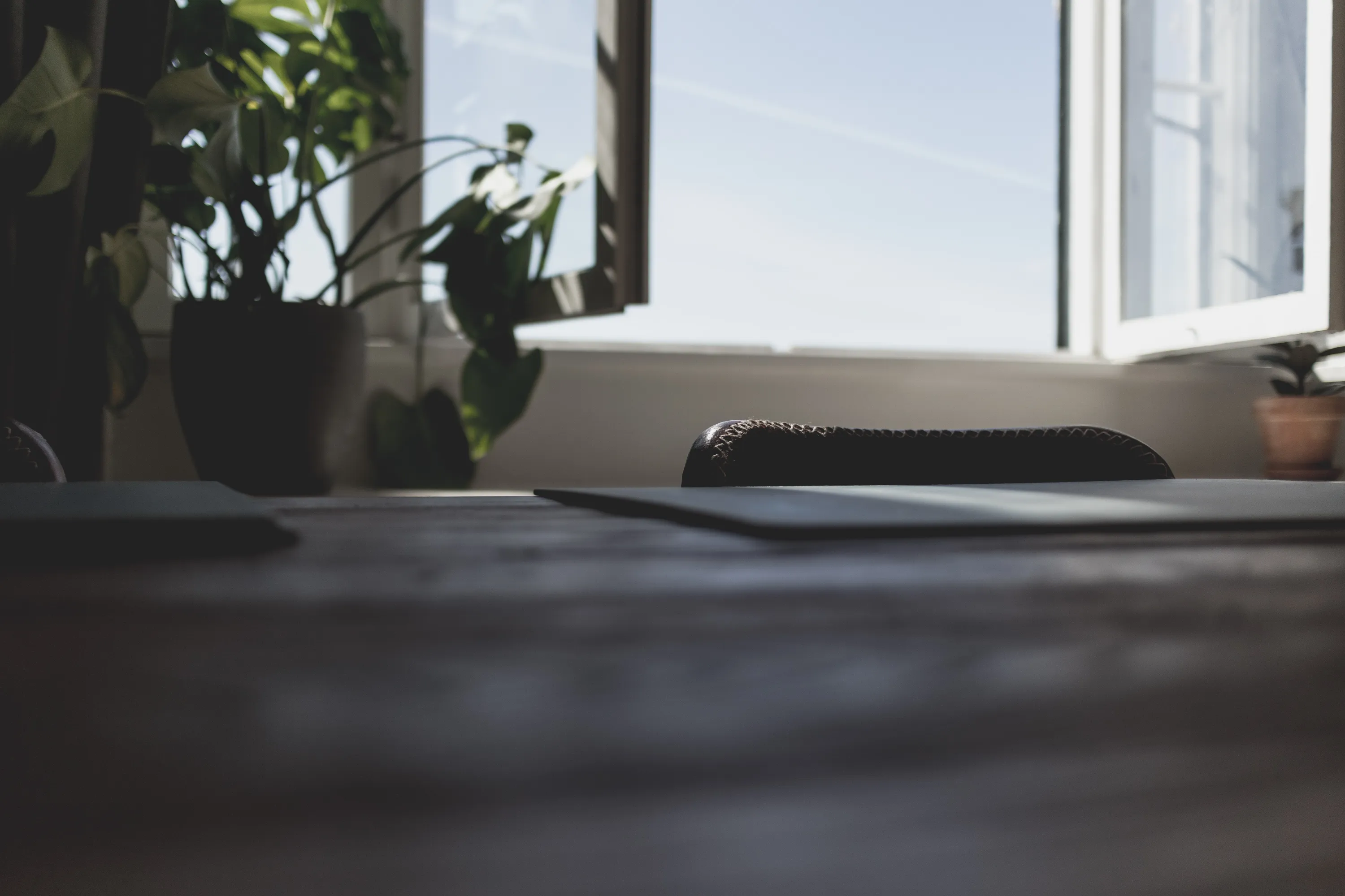 Desk with an open window on the background.