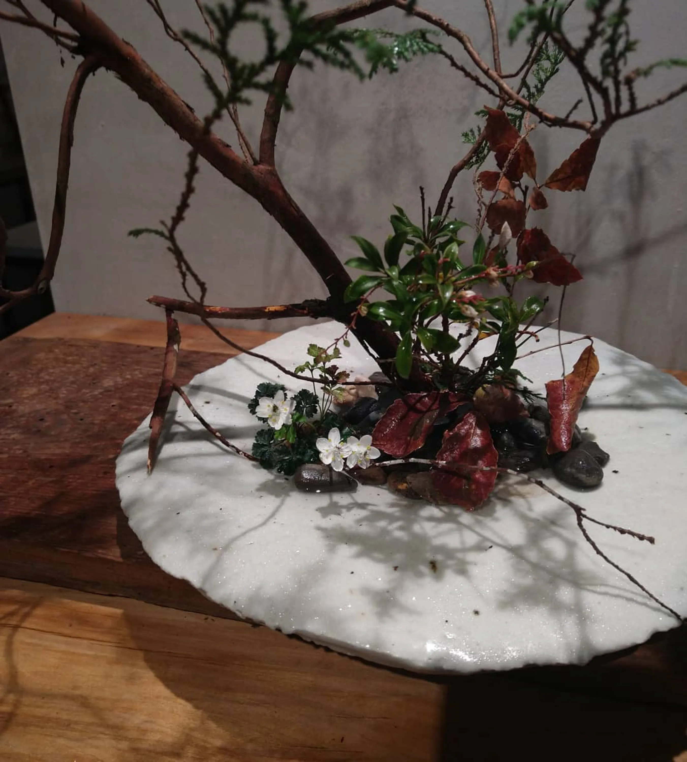 Simple leaves and branches arranged in ikebana.