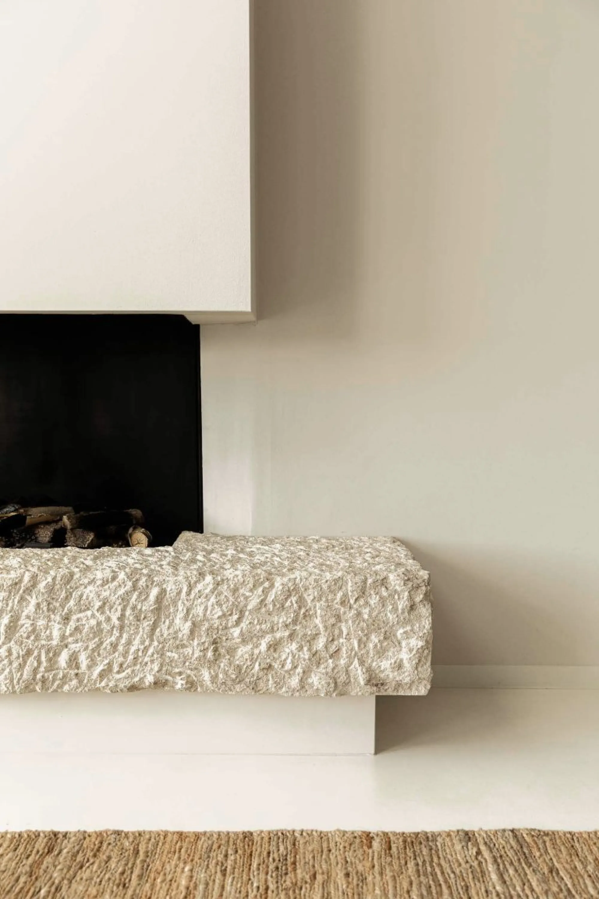 Fireplace with rough texture base.