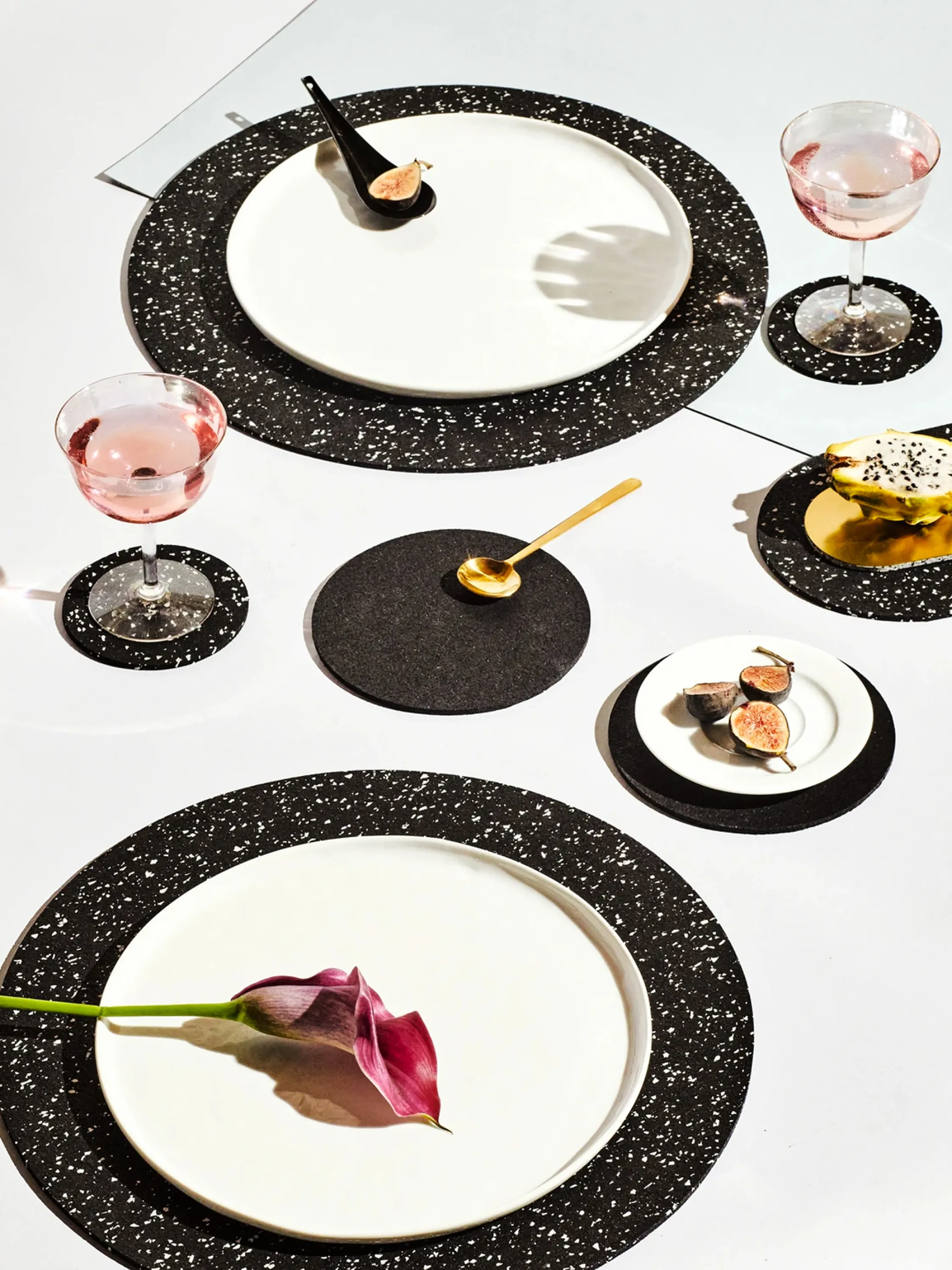 Table set with black recycled rubber placemats.