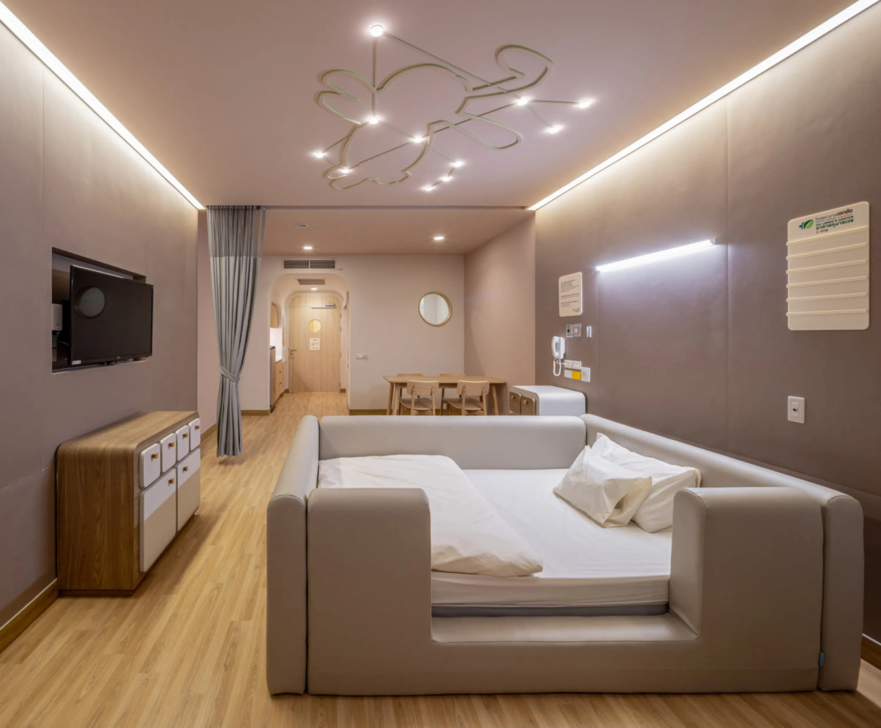 Patient room in a children hospital with rounded shaped furniture.