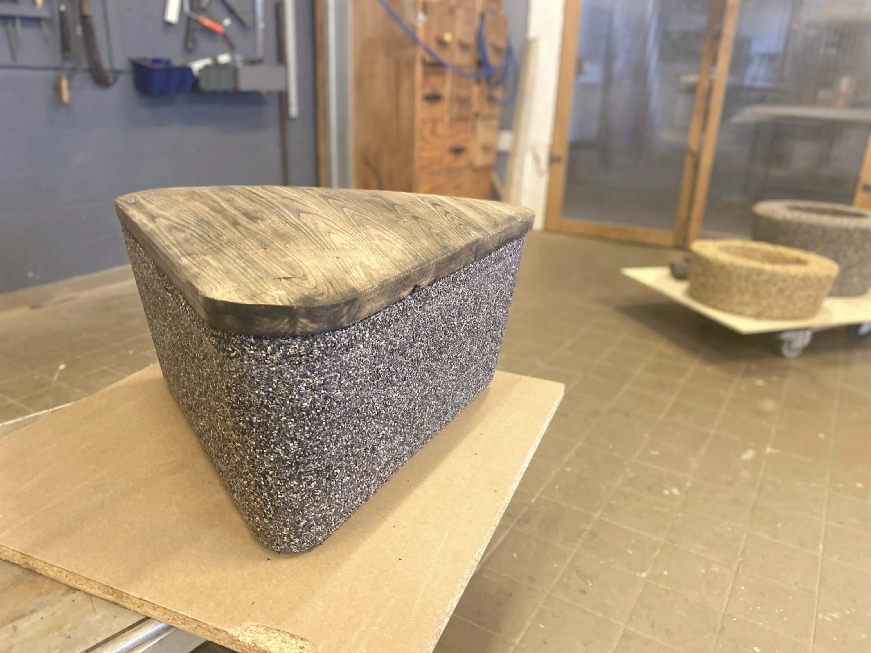 Mussel granulate ans wood pouf.
