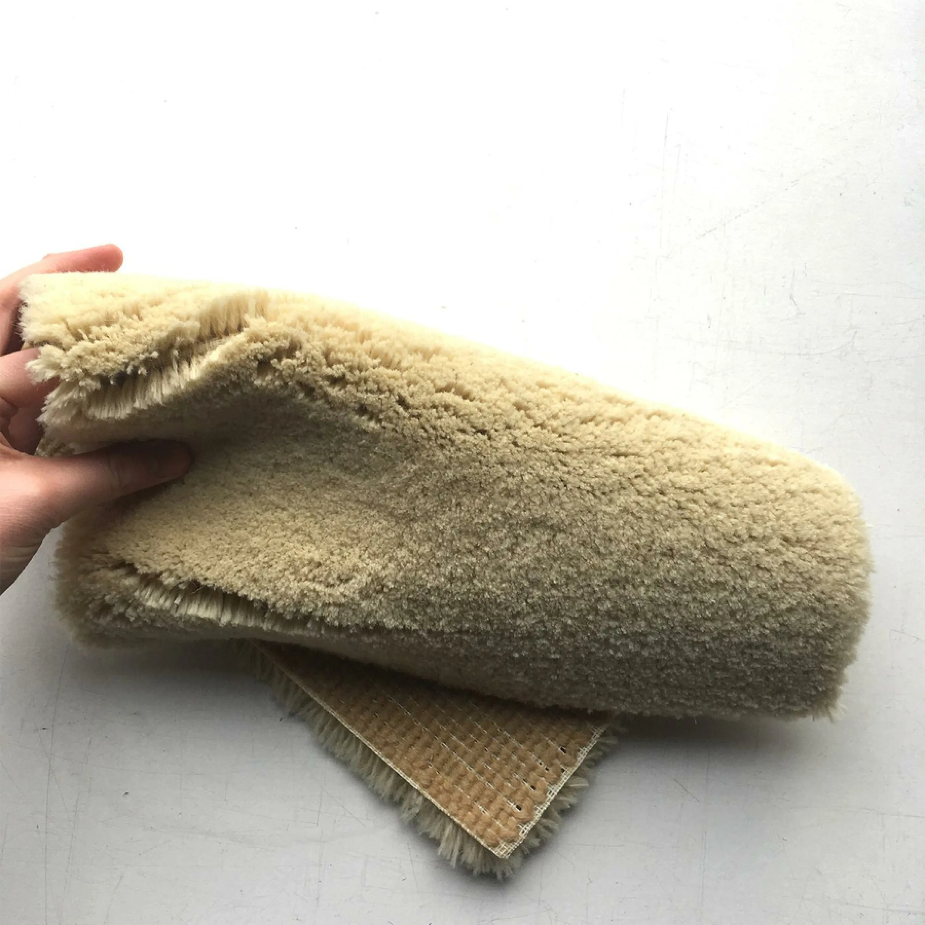 A piece of Robotuft rug folded.