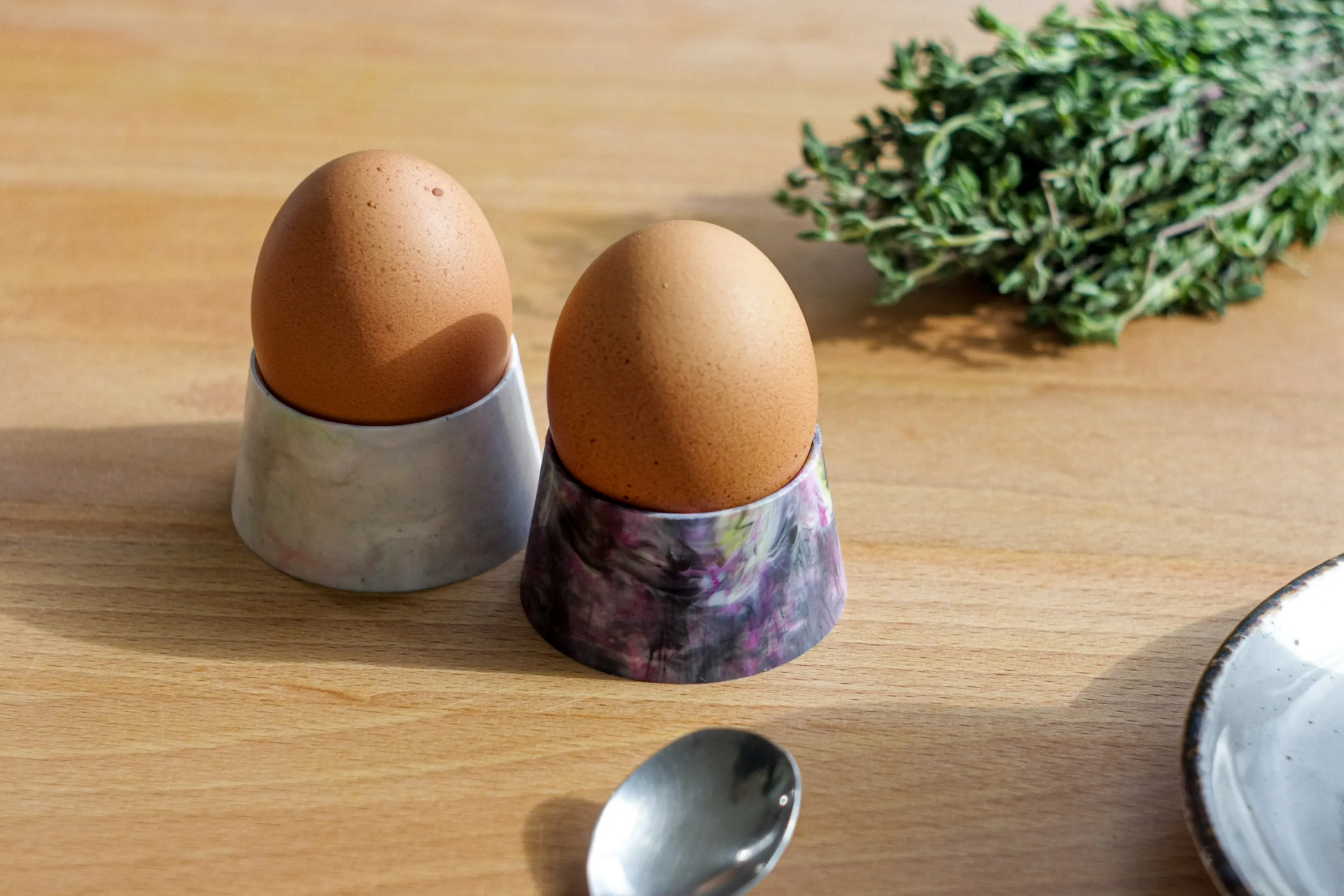Recycled plastic egg cups on a table.