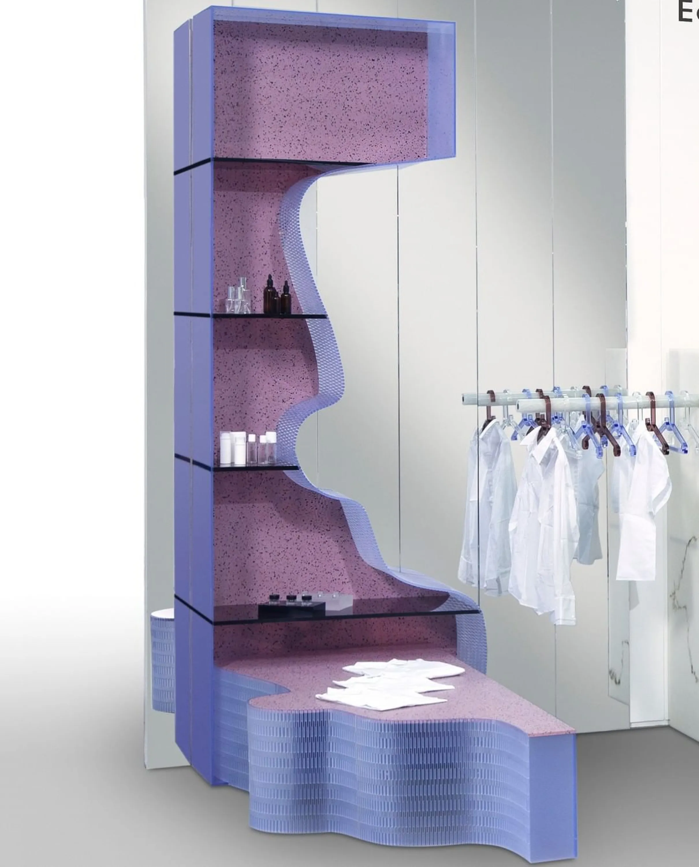 A retail shelving system made of colourful sheets of recycled plastic.