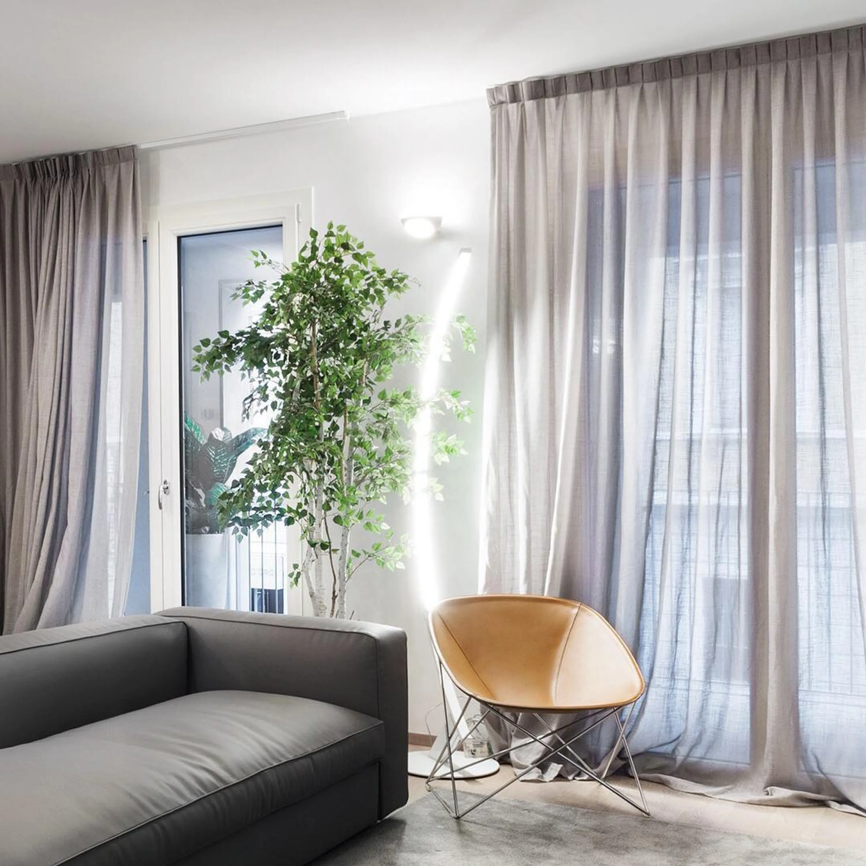 Minimal seating area with lighting behind.