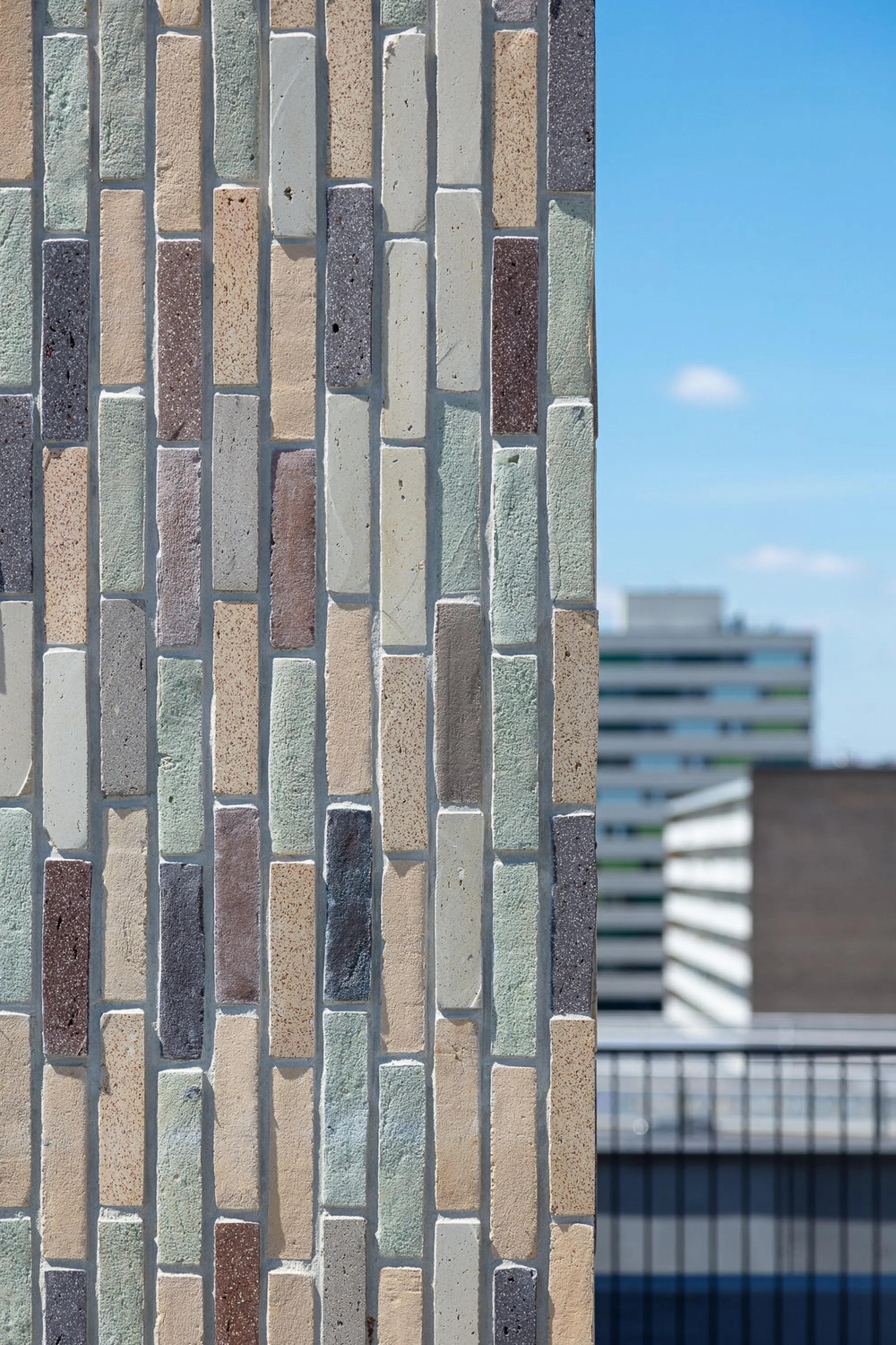 Close-up of the colourful waste-based bricks covering.